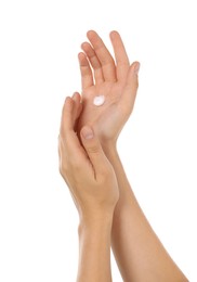 Photo of Woman applying cream on hand against white background, closeup