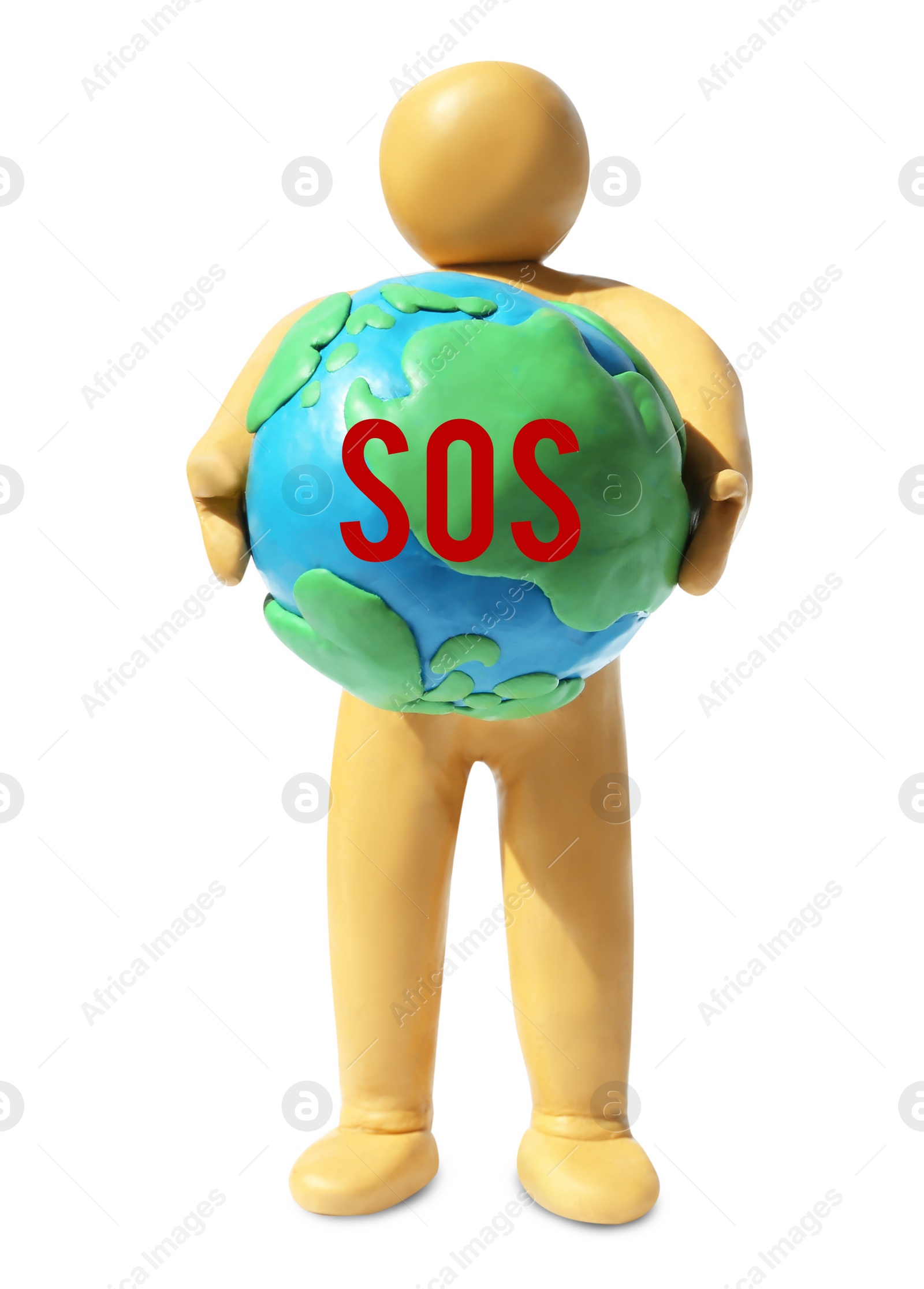 Image of Yellow plasticine human figure holding planet with word SOS isolated on white