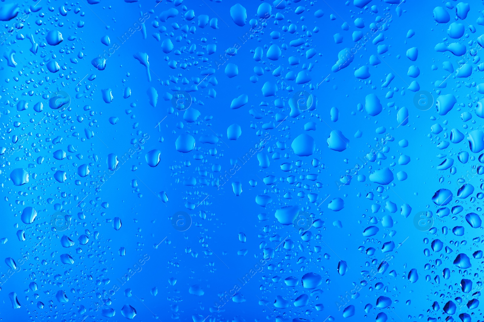 Photo of View of glass with water drops, closeup