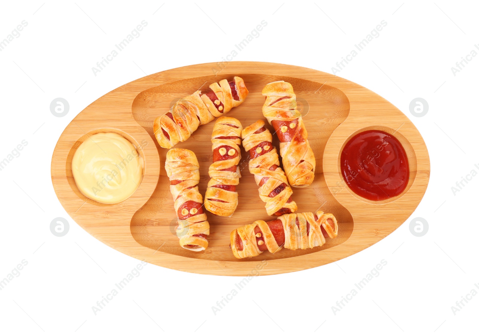 Photo of Cute sausage mummies served with sauce isolated on white, top view. Halloween party food