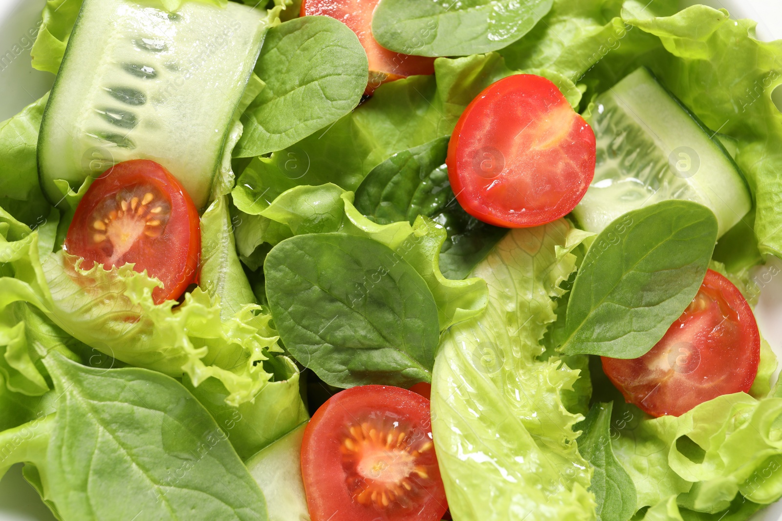 Photo of Delicious vegetable salad on white background, top view