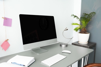 Comfortable workplace with computer on desk in home office