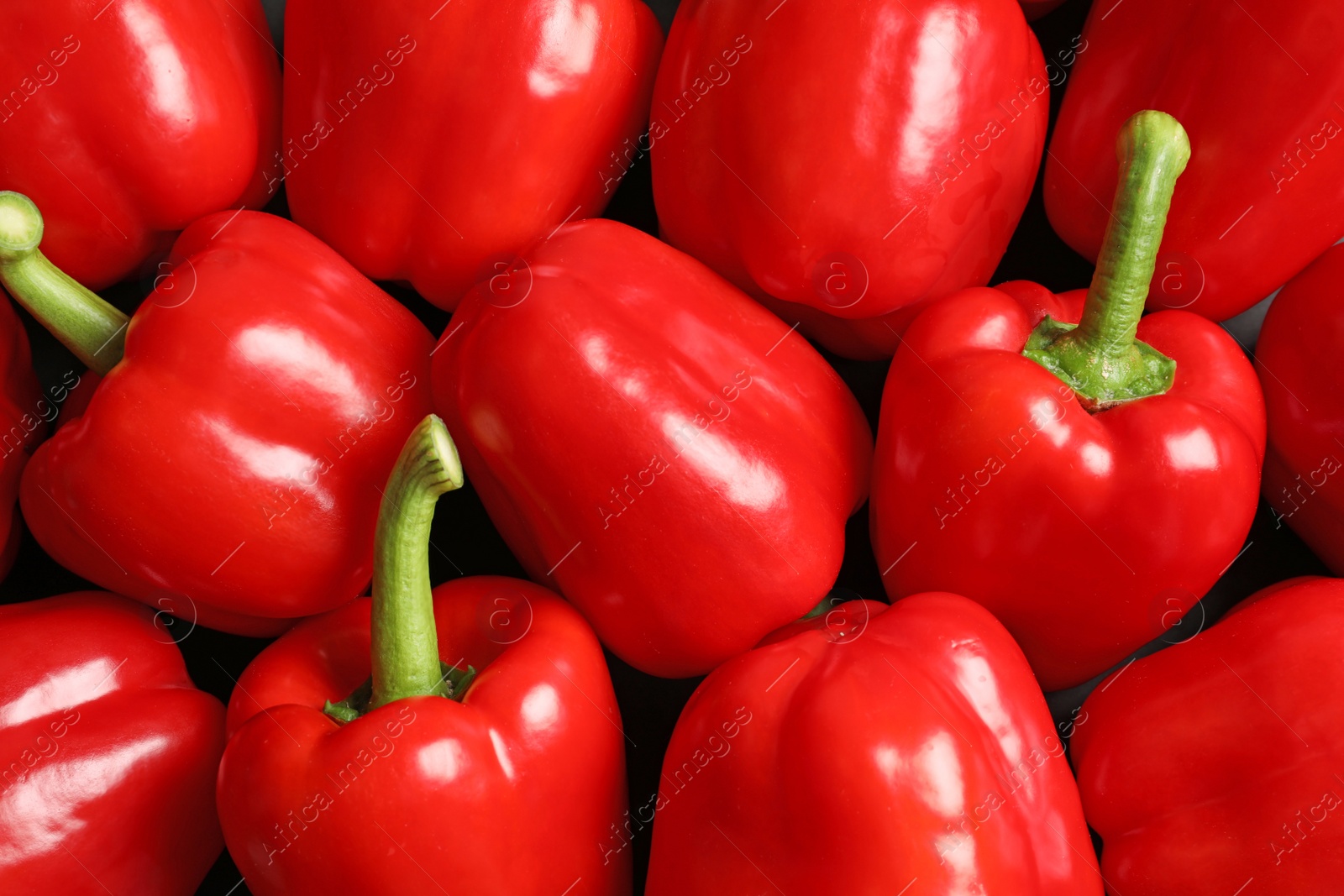 Photo of Many ripe red bell peppers as background, top view