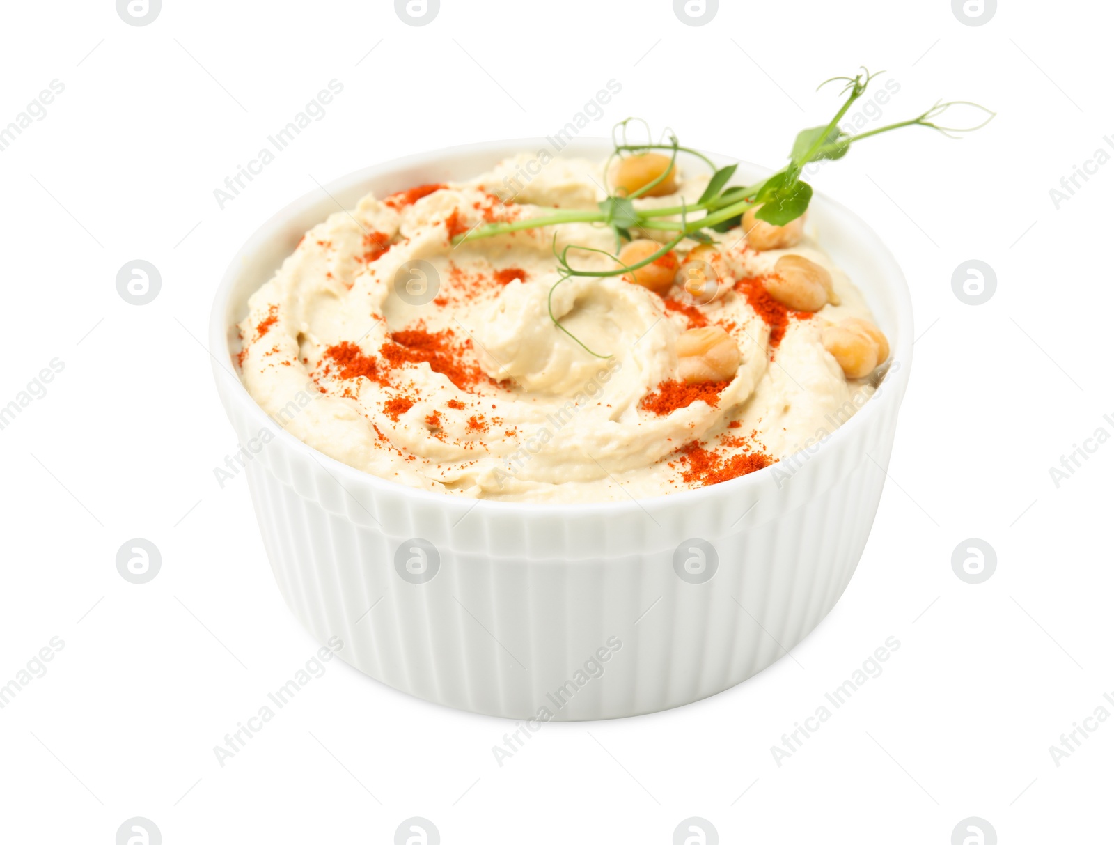 Photo of Bowl of delicious hummus with chickpeas and paprika isolated on white