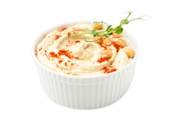 Bowl of delicious hummus with chickpeas and paprika isolated on white