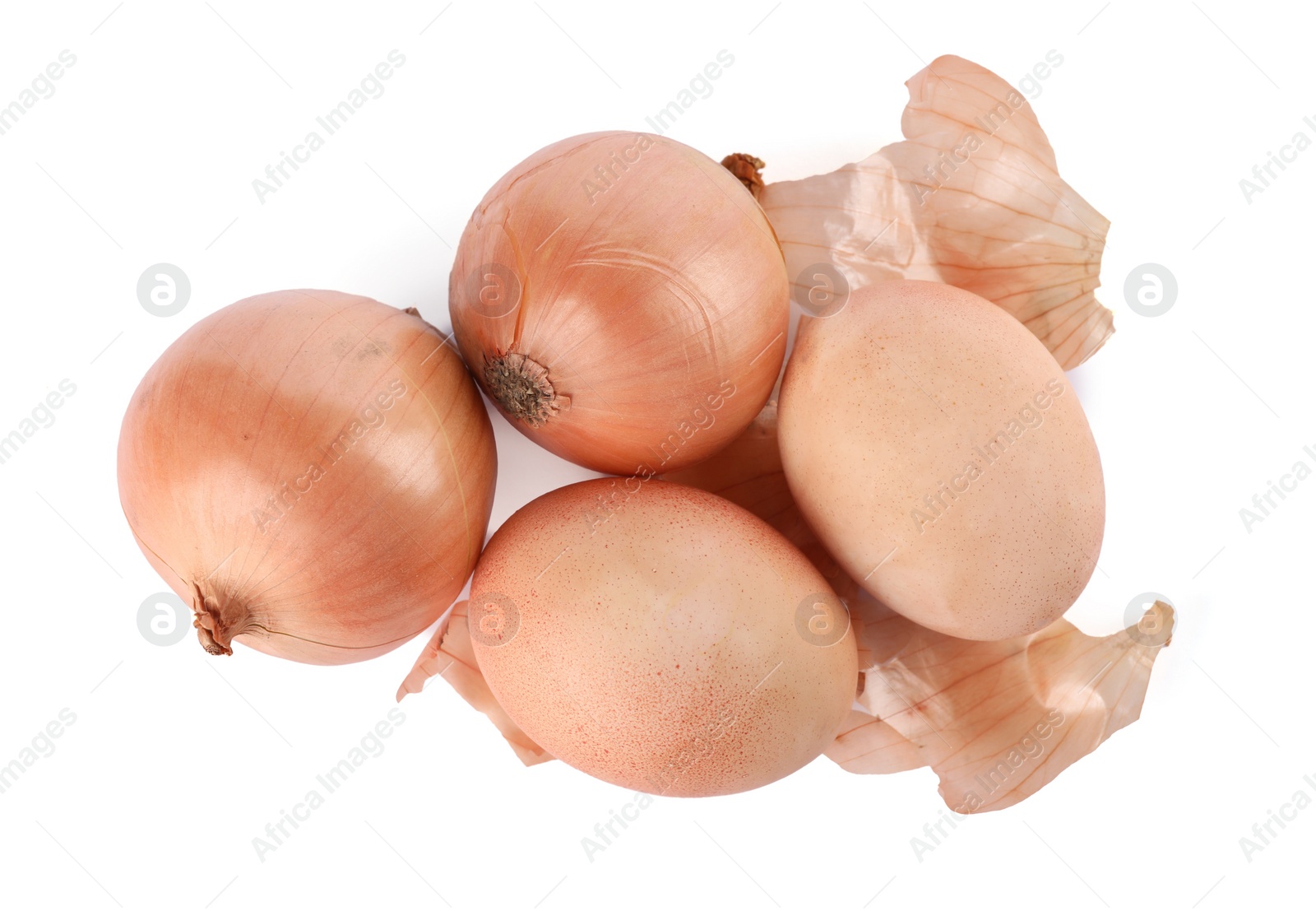 Photo of Easter eggs painted with natural dye and onions on white background, top view