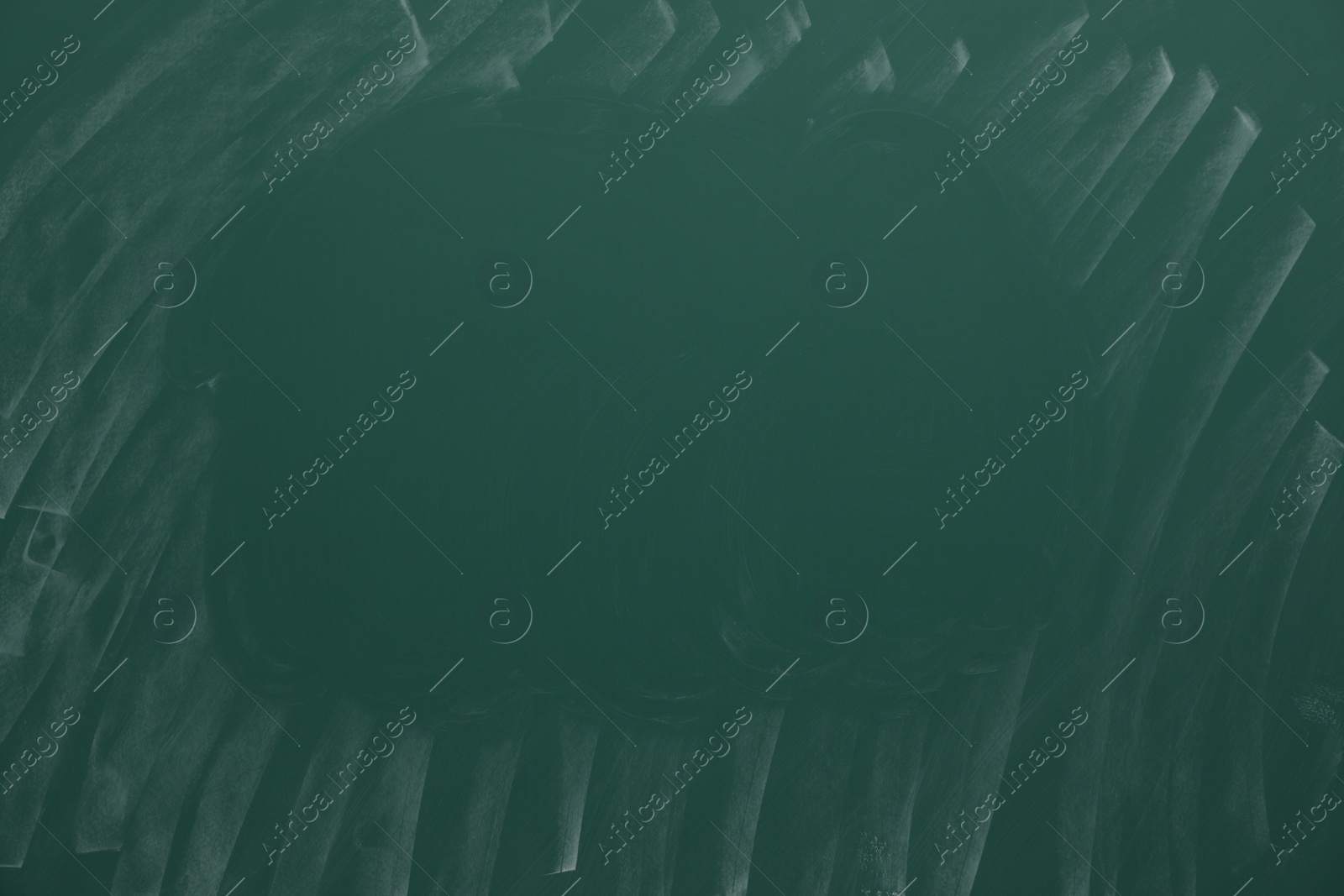 Photo of Dirty green chalkboard as background. School equipment