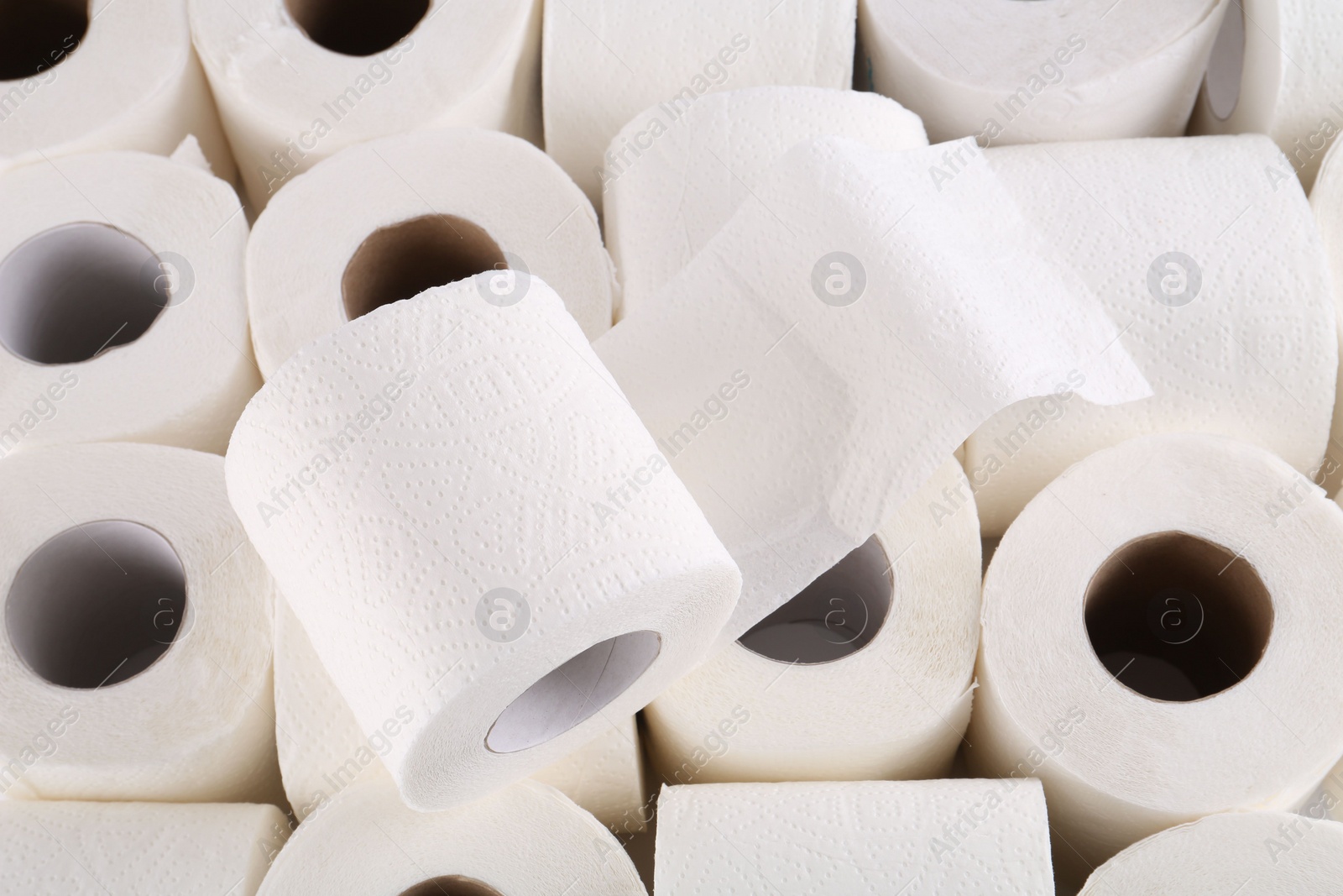 Photo of Many soft toilet paper rolls as background, closeup