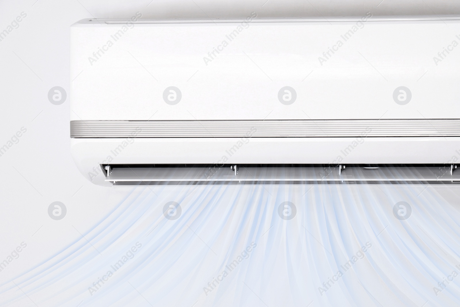 Image of Modern air conditioner on white wall indoors