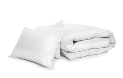 Photo of Clean blanket and pillows on white background