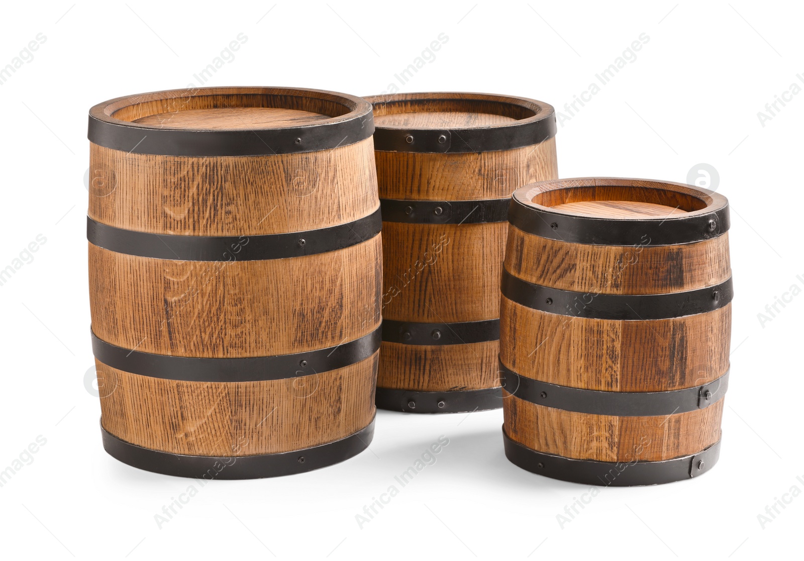 Photo of Three traditional wooden barrels on white background