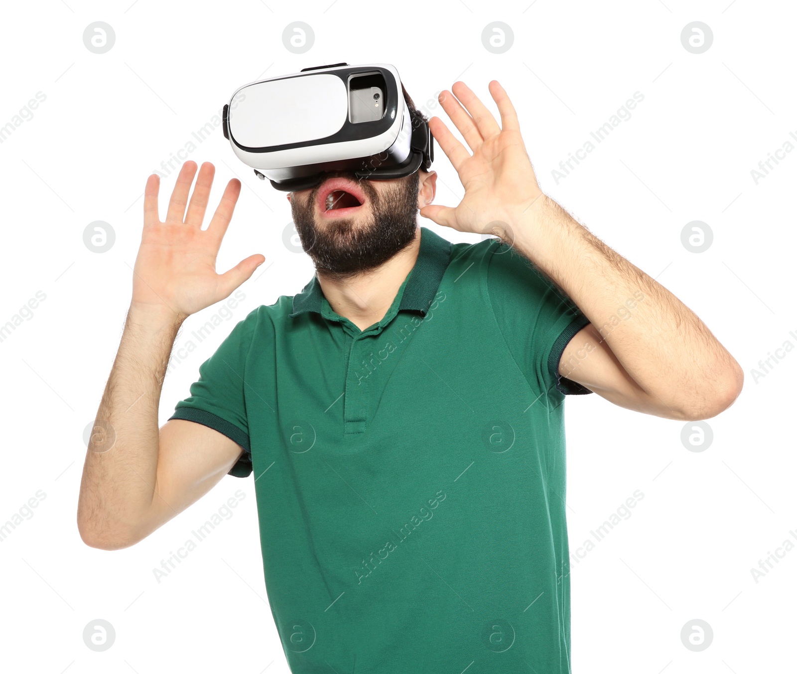 Photo of Emotional young man playing video games with virtual reality headset isolated on white