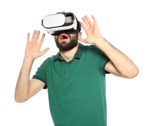 Emotional young man playing video games with virtual reality headset isolated on white