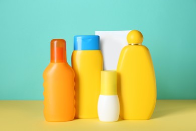 Many different suntan products on color background