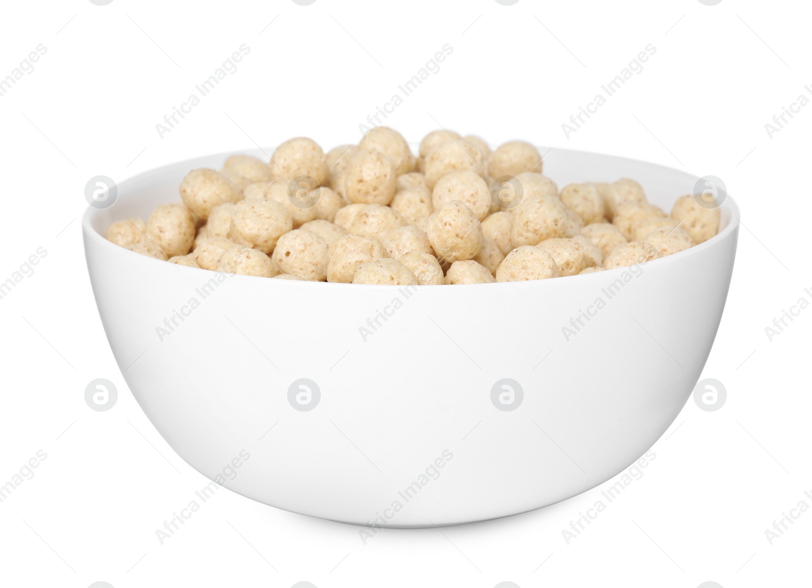 Photo of Tasty sweet cereal balls in bowl isolated on white