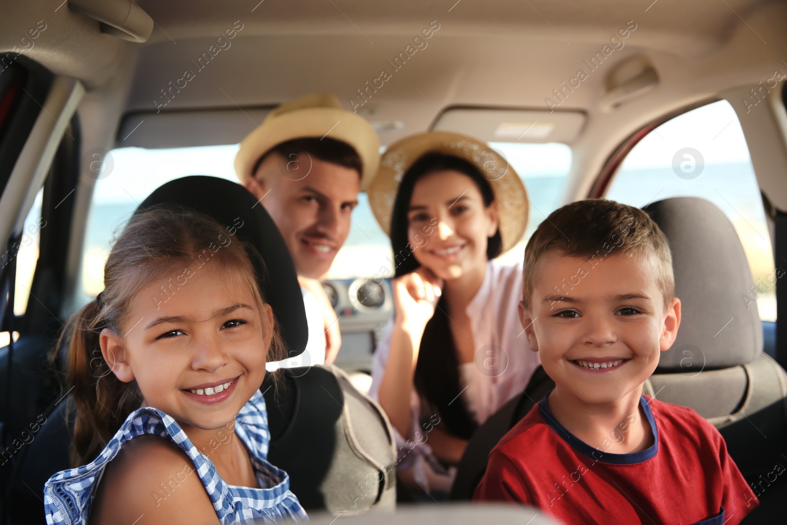 Photo of Happy family in car on road trip