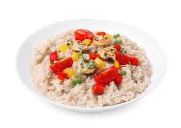 Delicious barley porridge with vegetables and microgreens in bowl isolated on white