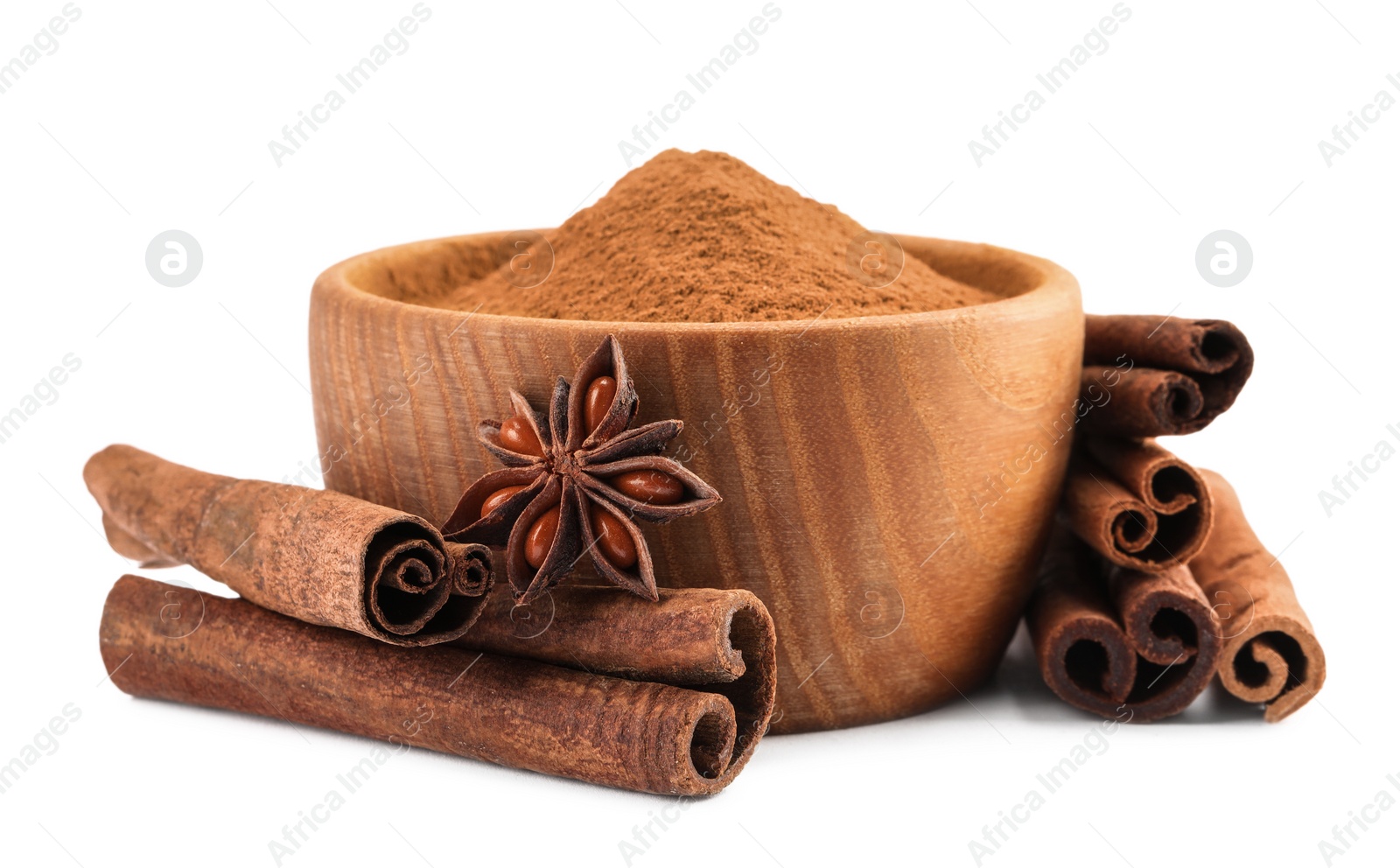 Photo of Dry aromatic cinnamon sticks, powder and anise star isolated on white