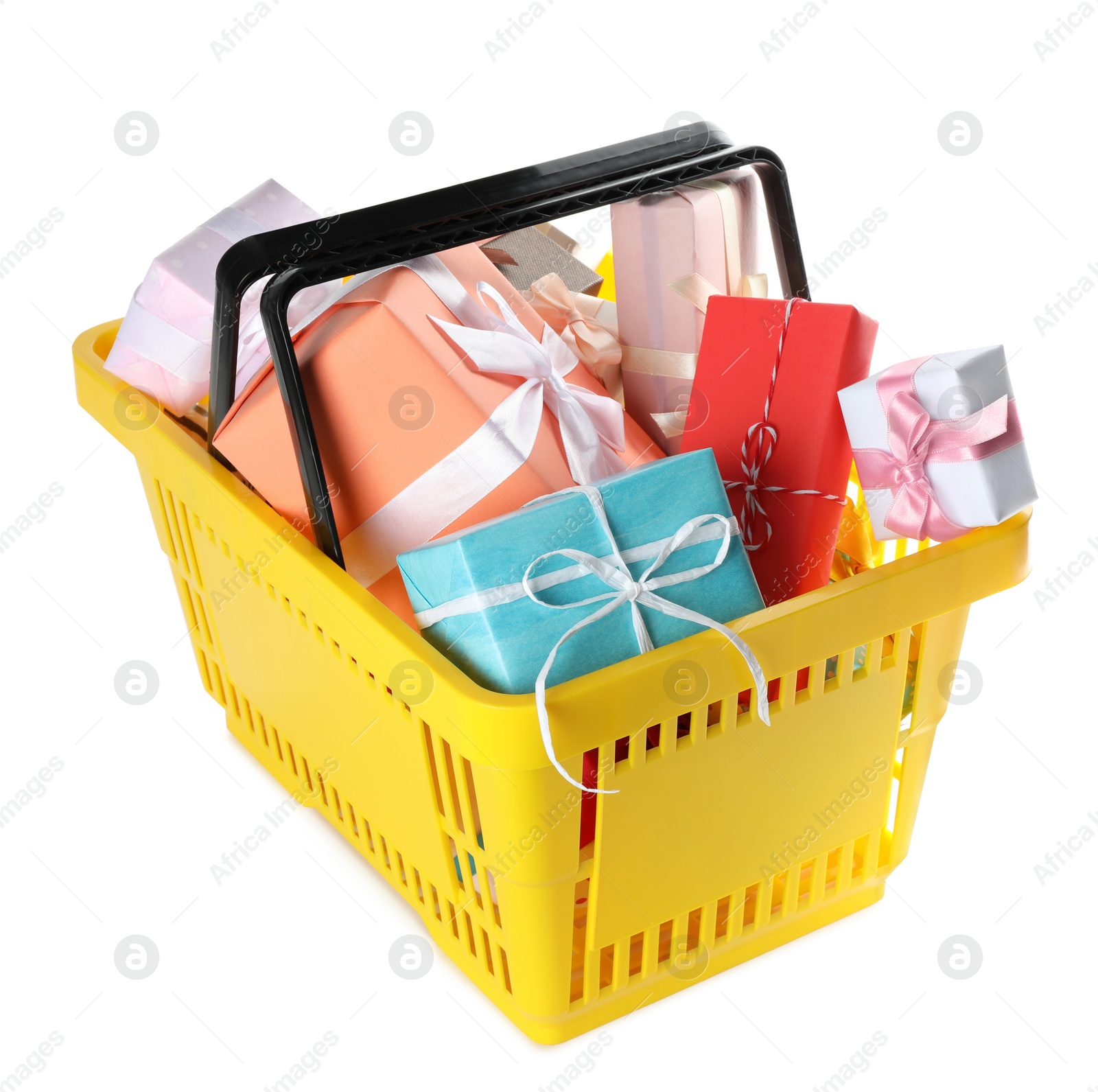 Photo of Shopping basket full of gift boxes on white background