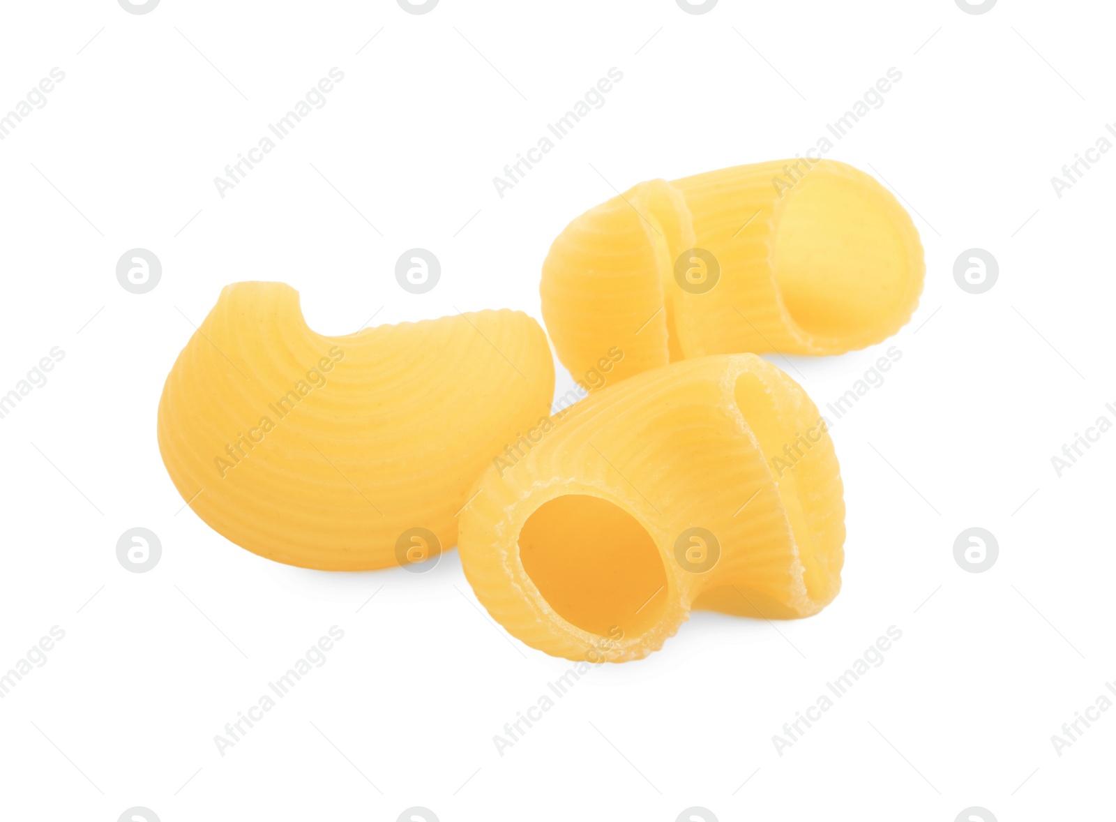 Photo of Raw horns pasta isolated on white. Italian cuisine