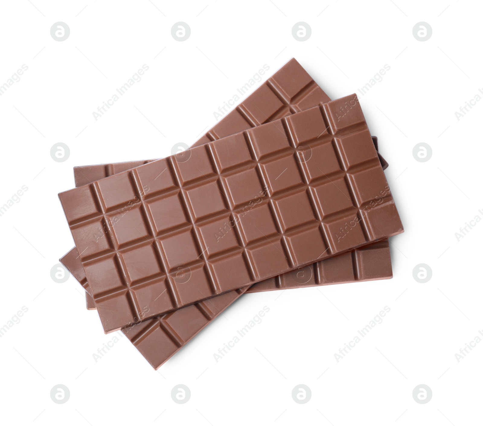 Photo of Delicious milk chocolate bars isolated on white, top view