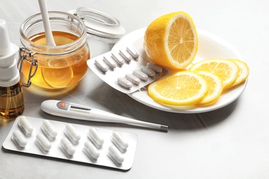 Photo of Natural and medical cold remedies on table