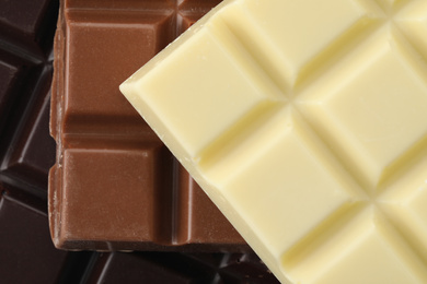 Different delicious chocolate as background, closeup view