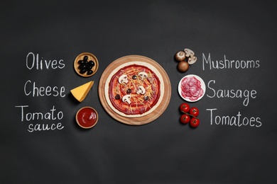 Pizza crust, ingredients and chalk written product's names on black background, flat lay