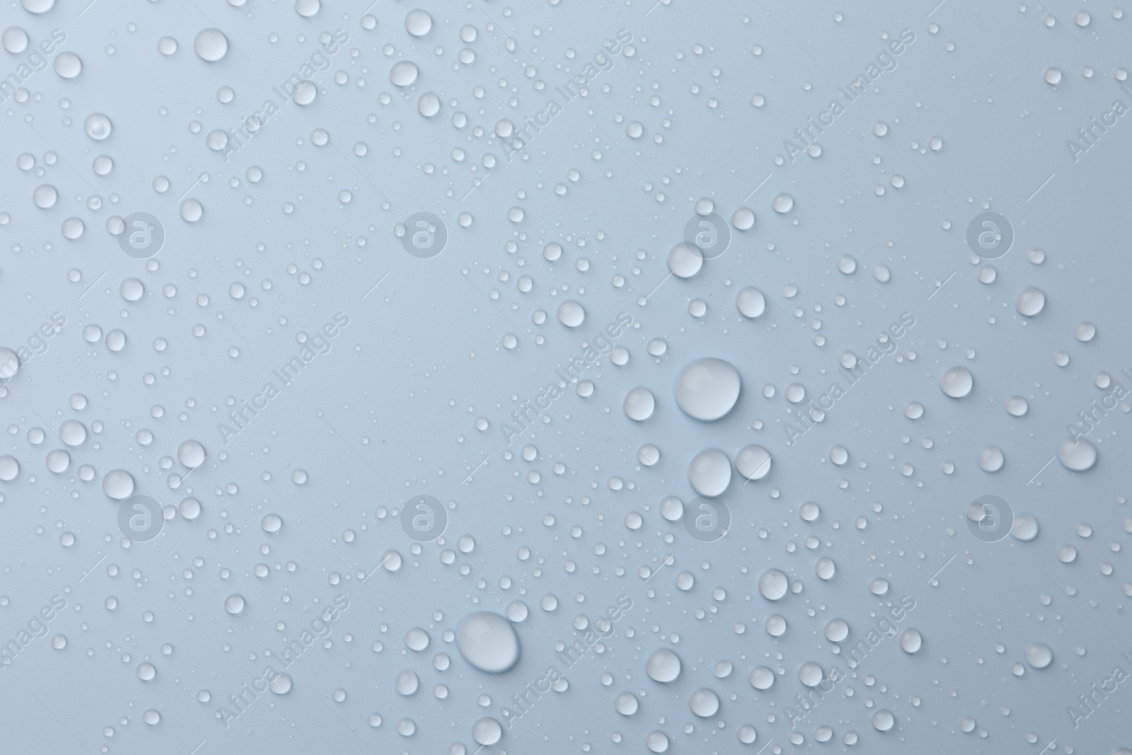 Photo of Many water drops on white background, top view