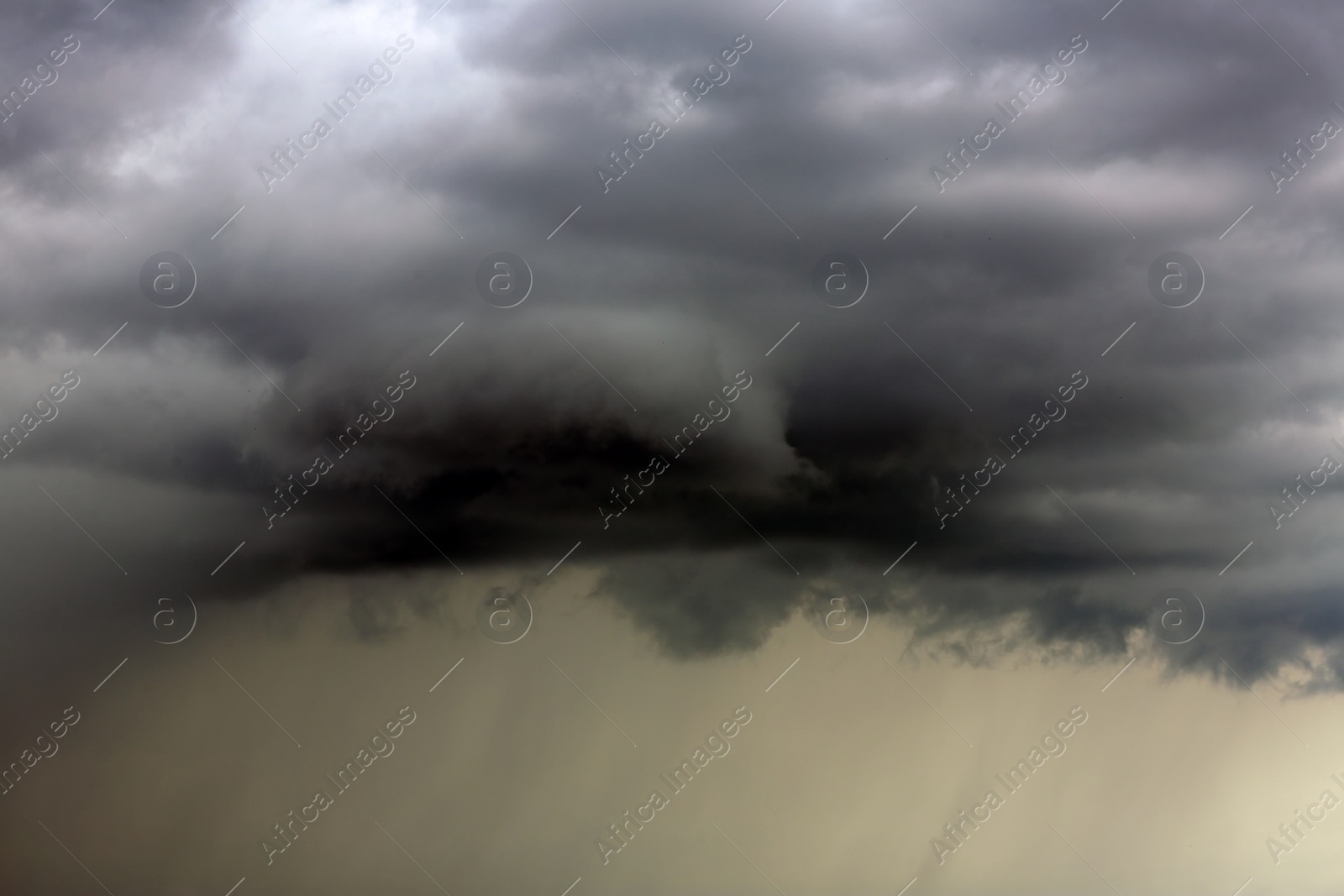 Photo of Sky with heavy rainy clouds on grey day