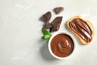 Photo of Flat lay composition with tasty chocolate mousse, bread and mint on table. Space for text