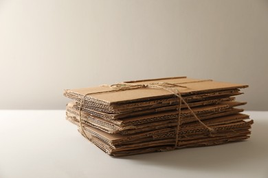 Photo of Stack of waste paper on beige background