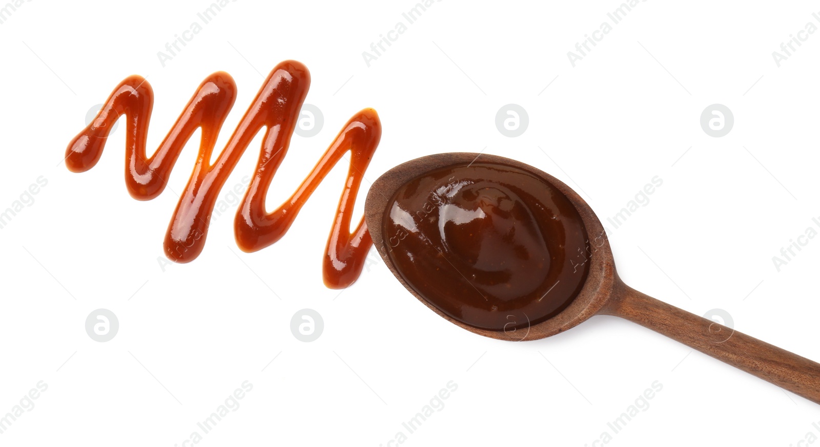 Photo of Tasty barbecue sauce and spoon isolated on white, top view