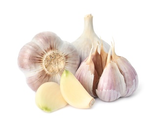 Photo of Fresh garlic bulbs and cloves isolated on white. Organic food