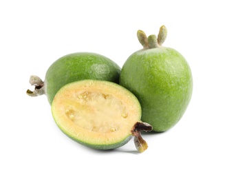 Whole and cut feijoa fruits on white background