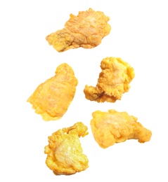 Image of Fresh fried chicken falling on white background