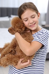 Photo of Little child with cute puppy at home. Lovely pet