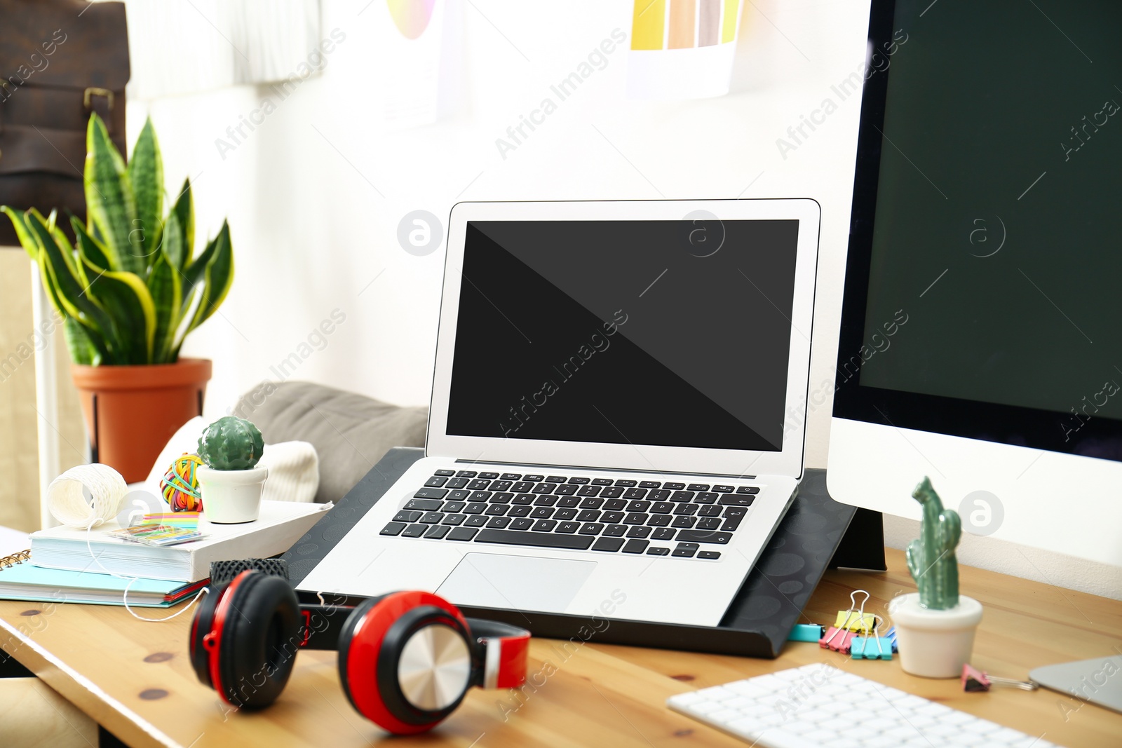 Image of Modern laptop on wooden table indoors. Comfortable workplace 