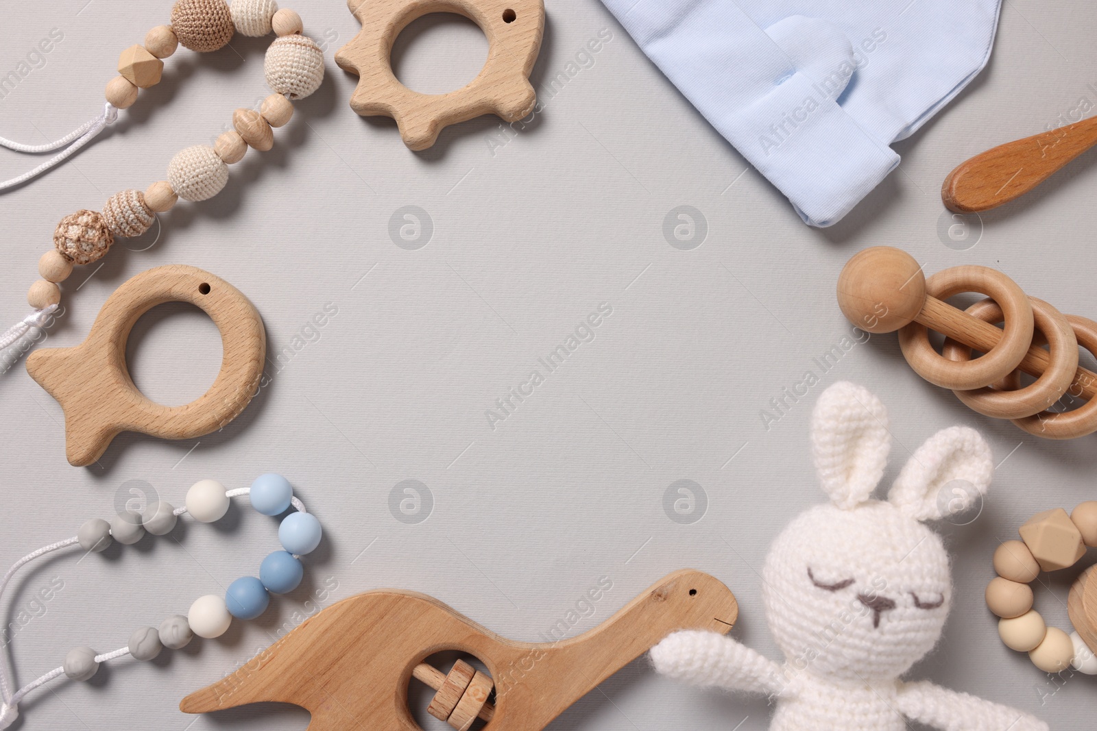 Photo of Different baby accessories on grey background, flat lay. Space for text