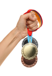 Woman holding medals on white background, closeup. Space for design