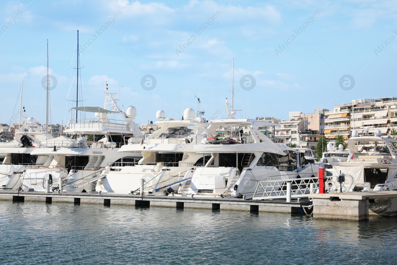 Photo of Picturesque view of port with modern boats on sunny day