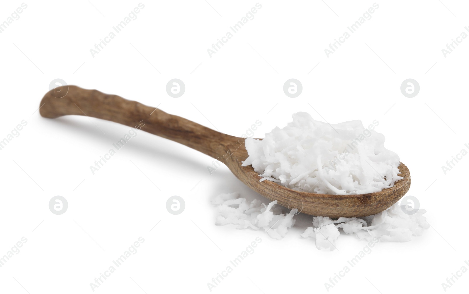 Photo of Coconut flakes in wooden spoon isolated on white