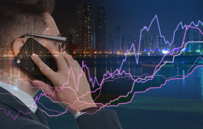 Image of Double exposure of businessman with smartphone and night cityscape. Stock exchange trading