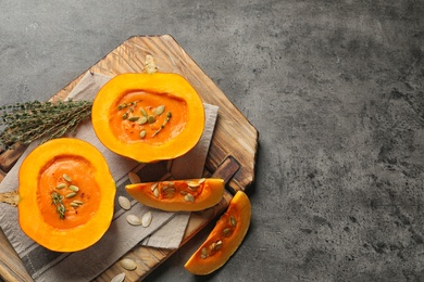 Photo of Flat lay composition with cream soup served in pumpkin and space for text on table