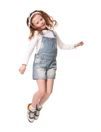 Photo of Cute little girl dancing on white background