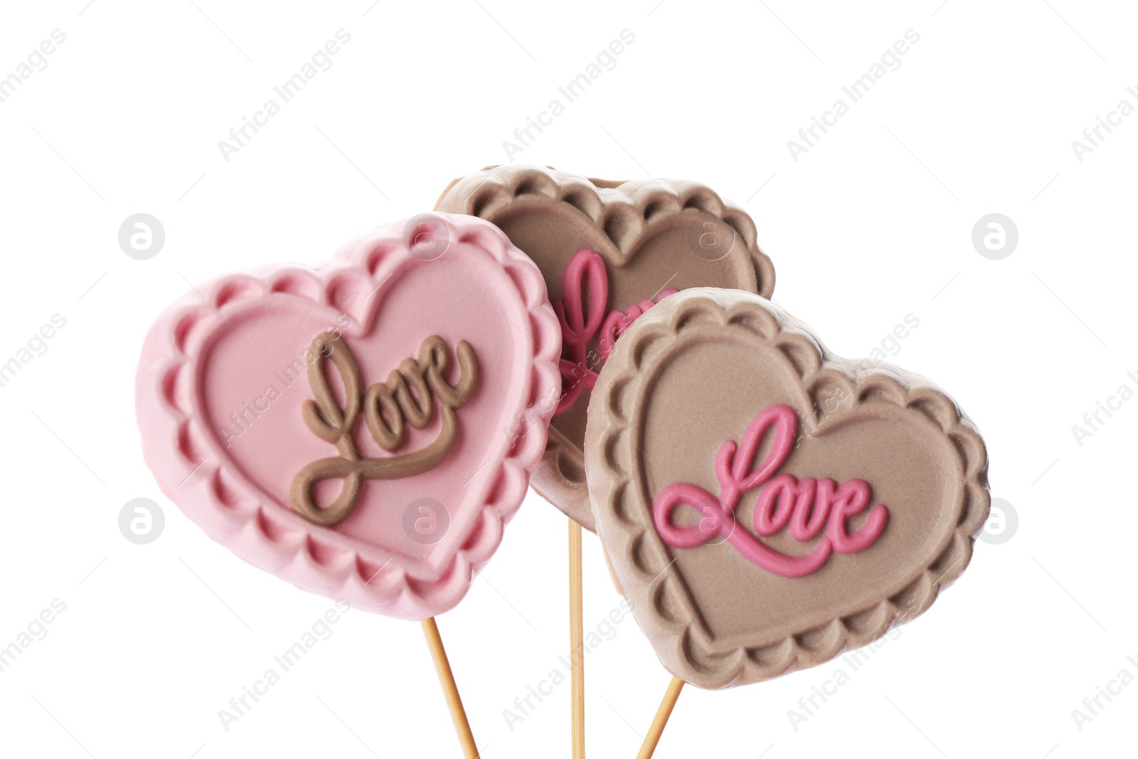 Photo of Heart shaped lollipops made of chocolate on white background