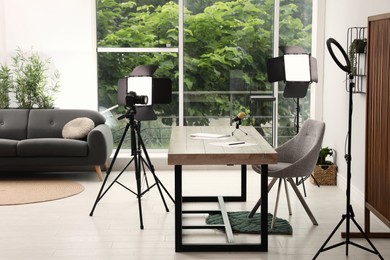 Modern blogger's workplace with professional equipment in room