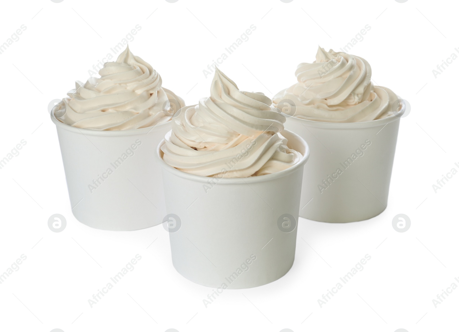 Photo of Cups with tasty frozen yogurt on white background