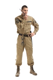 Male security guard using portable radio transmitter on white background