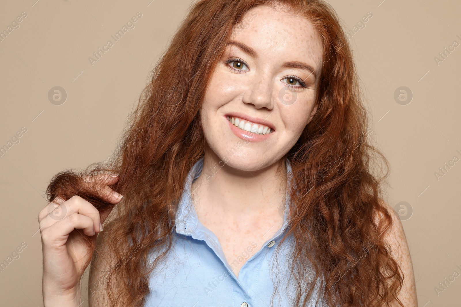 Photo of Portrait of young woman with beautiful face on beige background, closeup